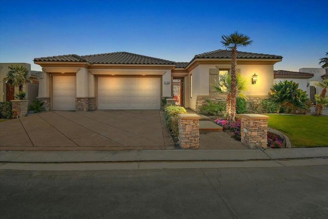 mediterranean / spanish-style home featuring a garage