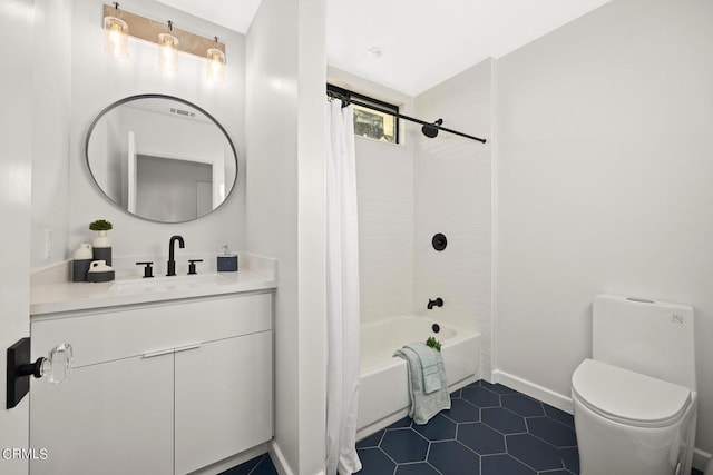 full bathroom featuring tile patterned floors, toilet, vanity, and shower / bath combo