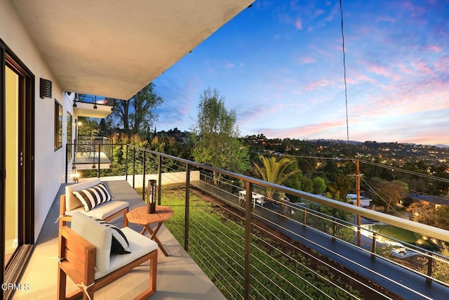 view of balcony at dusk