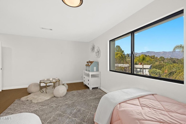 bedroom with a mountain view