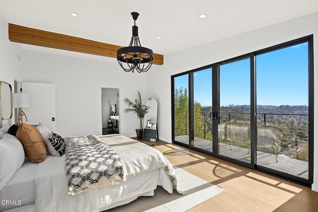 bedroom featuring beam ceiling, access to outside, and hardwood / wood-style flooring