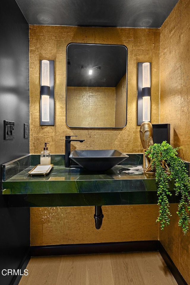 bathroom featuring hardwood / wood-style flooring and sink