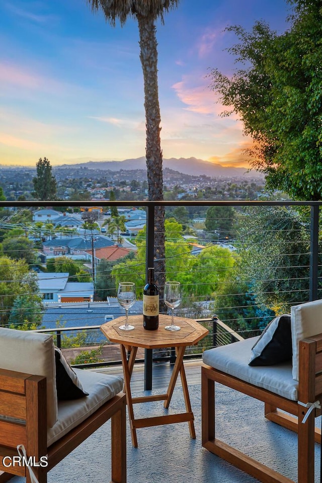 view of balcony at dusk