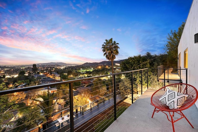 balcony at dusk with a mountain view