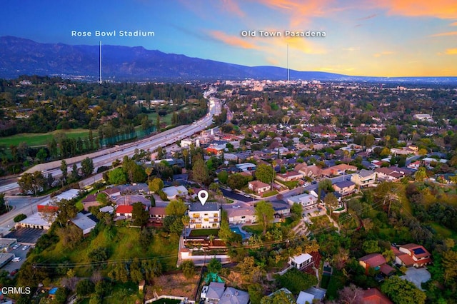 aerial view at dusk with a mountain view