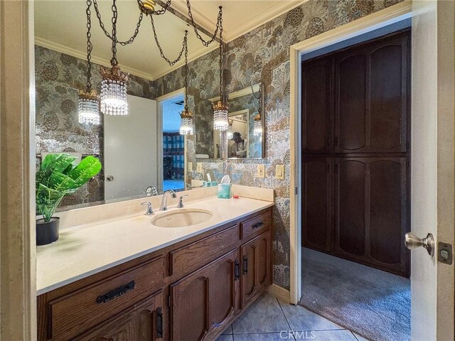 bathroom featuring wallpapered walls, tile patterned flooring, ornamental molding, and vanity