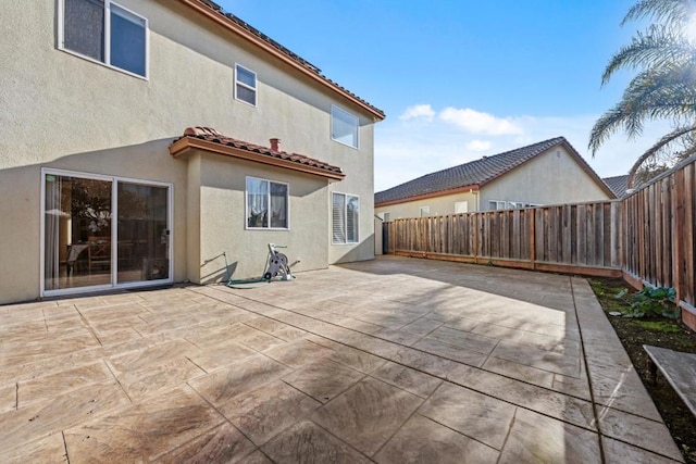 rear view of house featuring a patio