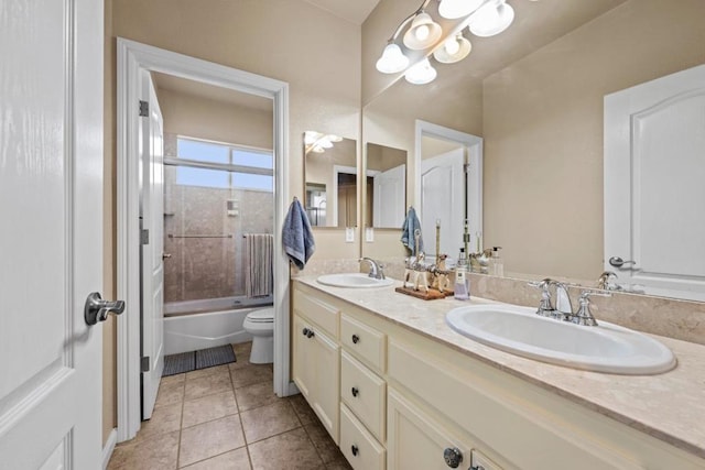 full bathroom with vanity, combined bath / shower with glass door, tile patterned floors, and toilet