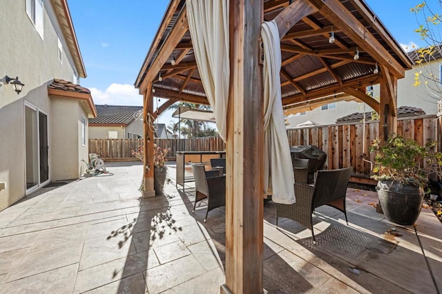 view of patio / terrace featuring a gazebo and grilling area