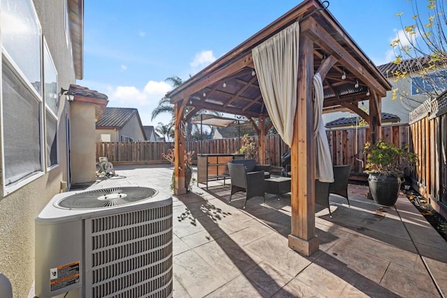 view of patio with a gazebo, outdoor lounge area, and central AC unit