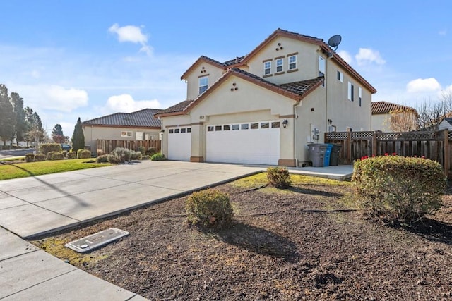 mediterranean / spanish-style home featuring a garage