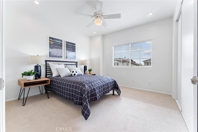 carpeted bedroom featuring ceiling fan