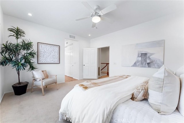 carpeted bedroom with ceiling fan