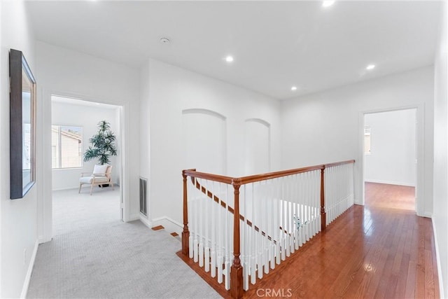 hall with light hardwood / wood-style floors