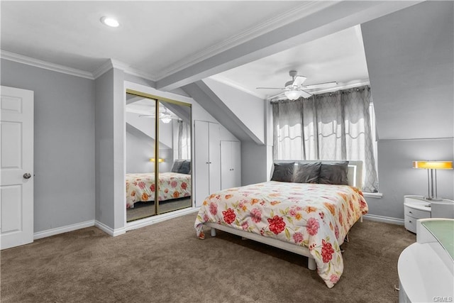 carpeted bedroom with a closet, ceiling fan, and ornamental molding