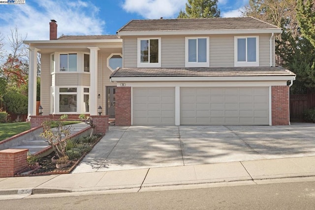 front facade with a garage