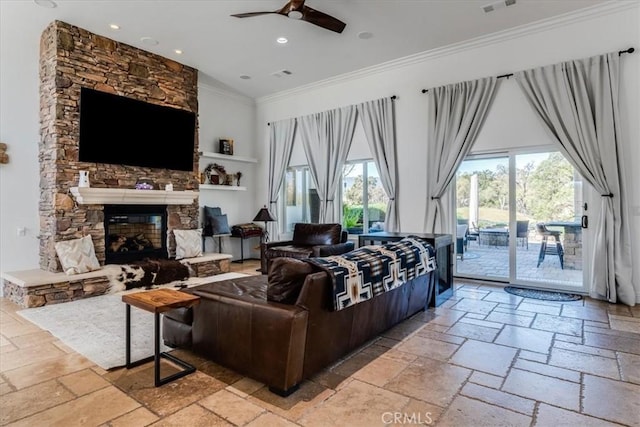 living room with crown molding, lofted ceiling, ceiling fan, and a fireplace