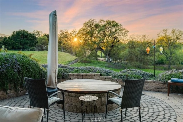 view of patio terrace at dusk