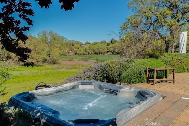 view of pool featuring a hot tub