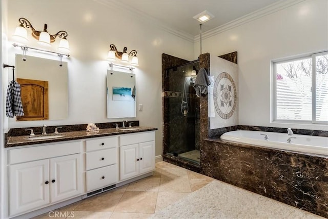 bathroom with tile patterned flooring, crown molding, shower with separate bathtub, and vanity