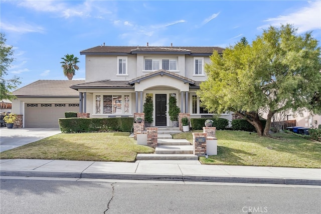 view of front of house featuring a garage and a front yard