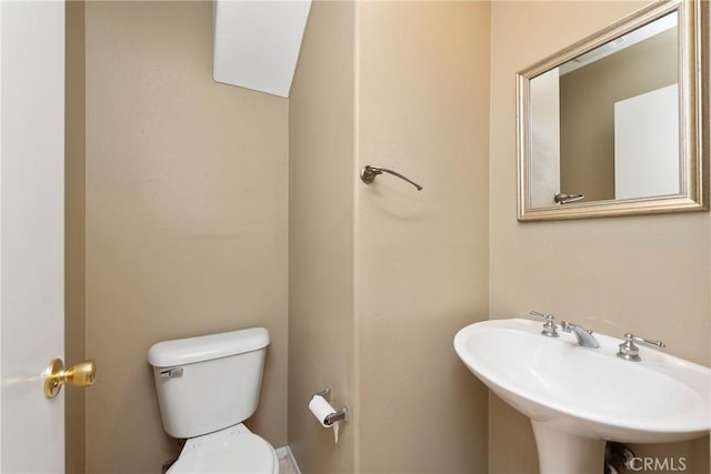 bathroom with sink and toilet