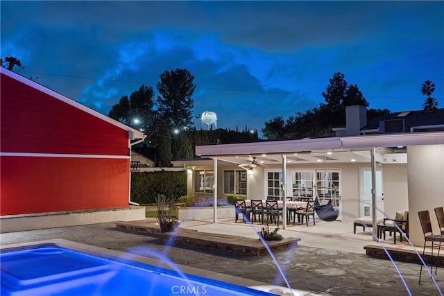 exterior space featuring ceiling fan and french doors