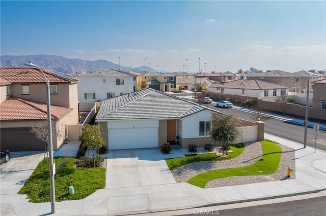 view of front of home featuring a mountain view and a garage