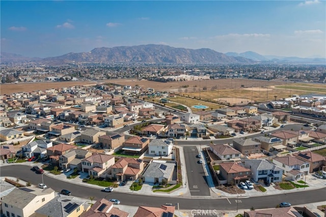 birds eye view of property featuring a mountain view