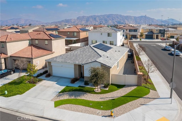 birds eye view of property with a mountain view