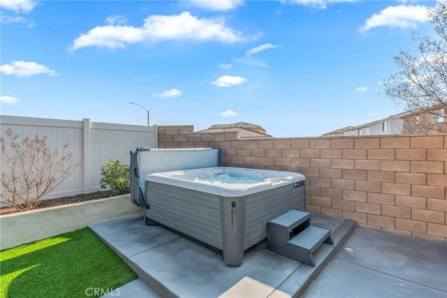 view of patio featuring a hot tub