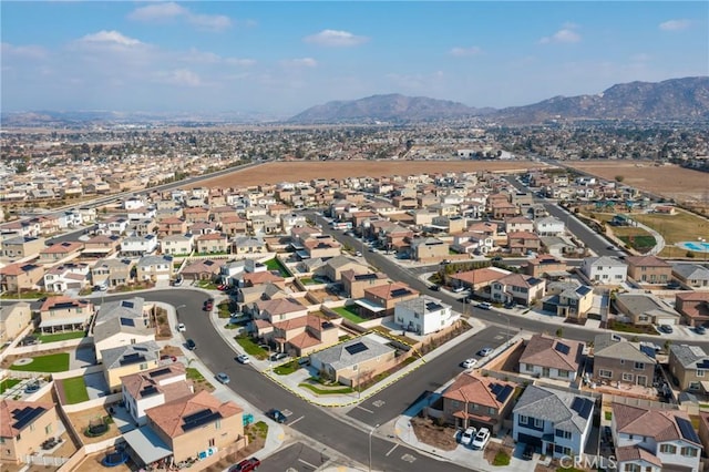 birds eye view of property with a mountain view