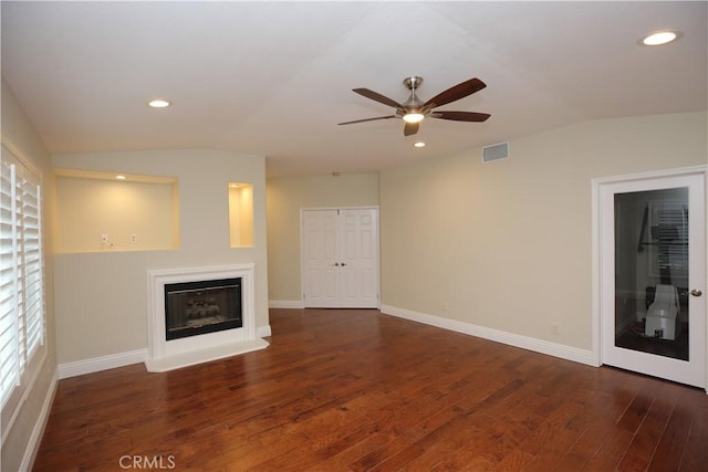 unfurnished living room featuring ceiling fan, lofted ceiling, and dark hardwood / wood-style flooring