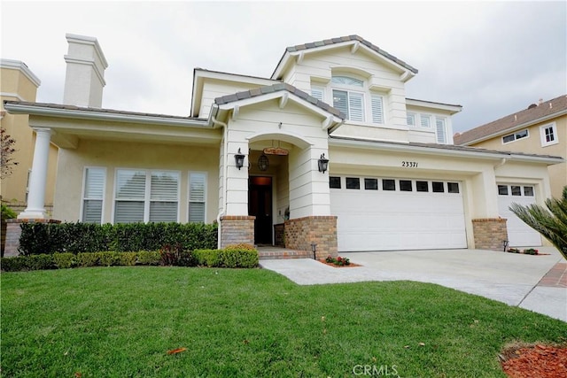 view of front facade with a garage and a front yard