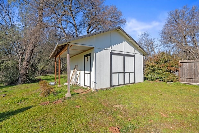 view of outdoor structure with a lawn