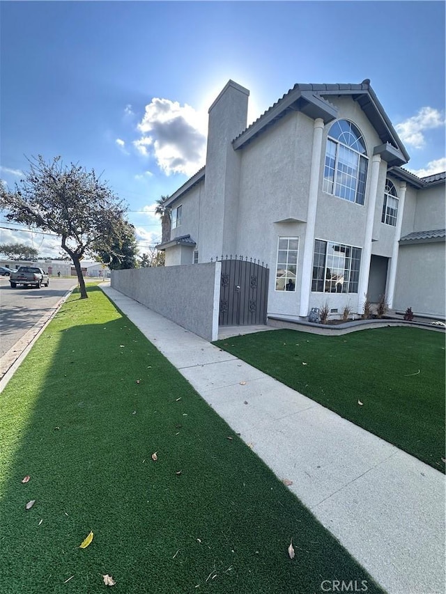 view of home's exterior with a lawn