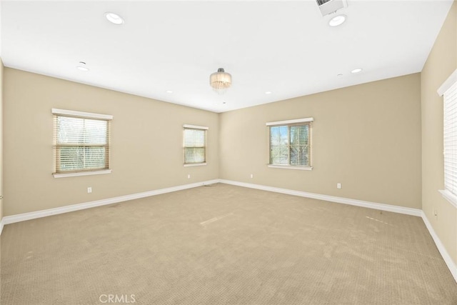 unfurnished room with light colored carpet