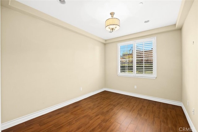 empty room featuring wood-type flooring