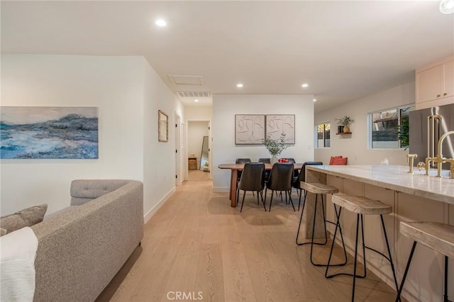 dining room with light wood-type flooring