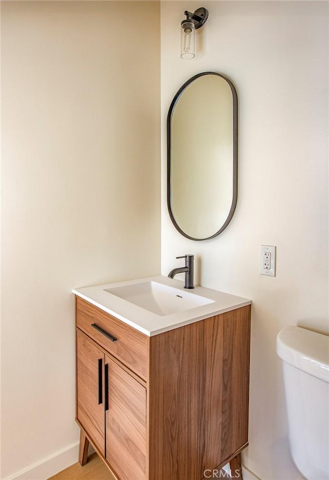 bathroom with vanity and toilet