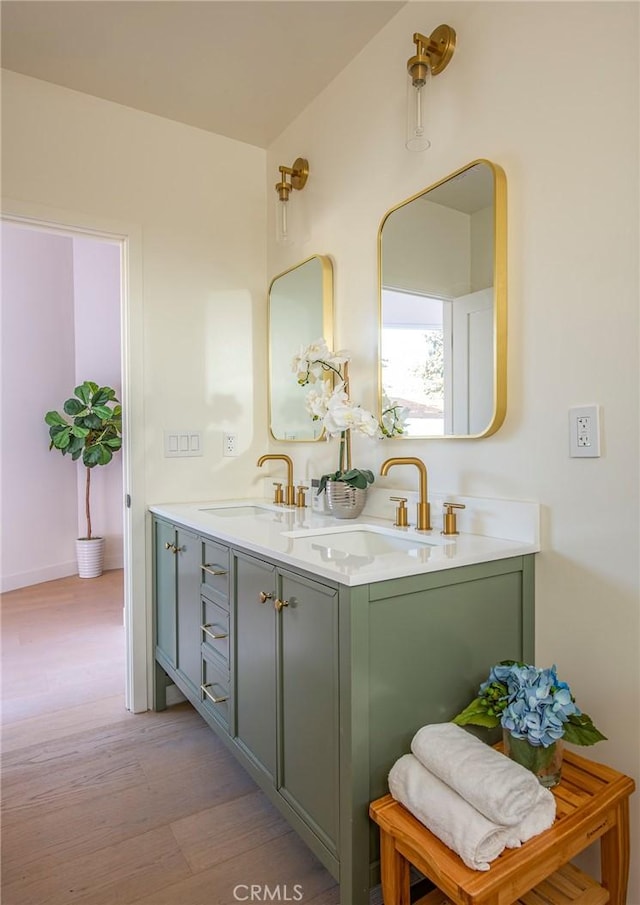 bathroom with vanity and hardwood / wood-style flooring