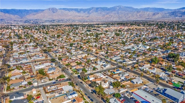 birds eye view of property with a residential view and a mountain view