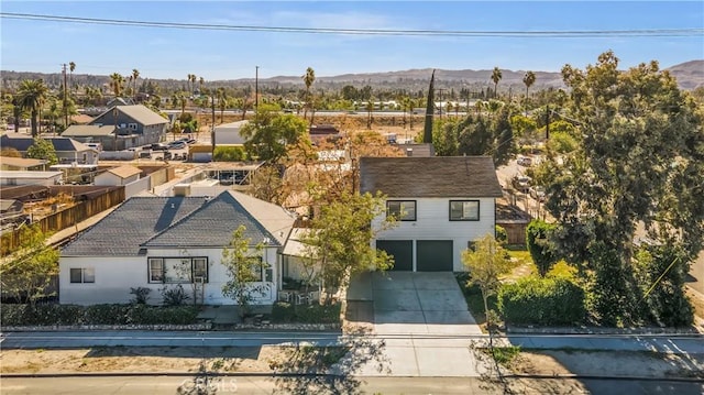 birds eye view of property featuring a mountain view