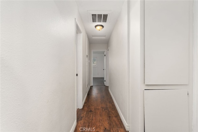 hallway with dark wood-type flooring