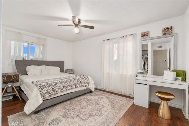 bedroom featuring dark wood-type flooring and ceiling fan