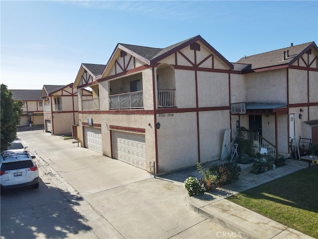 view of front of home featuring a balcony and a garage