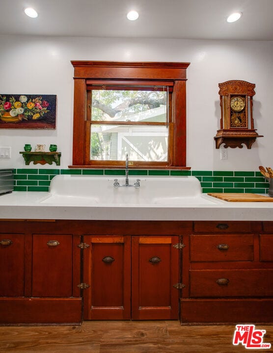 bathroom with wood-type flooring