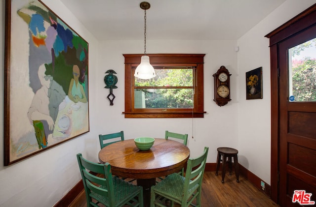 dining area featuring dark hardwood / wood-style flooring