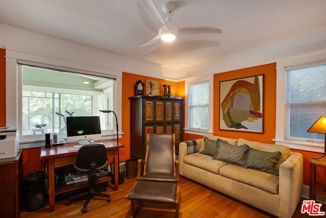 office area with hardwood / wood-style floors, a healthy amount of sunlight, and ceiling fan