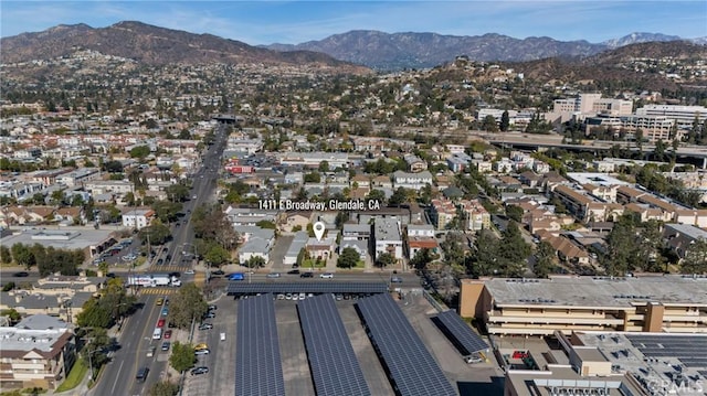 birds eye view of property with a mountain view